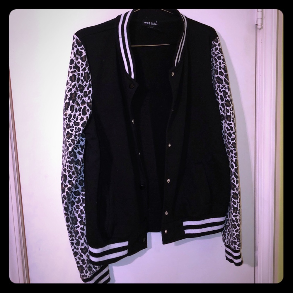 Jacket , cheetah print sleeves.